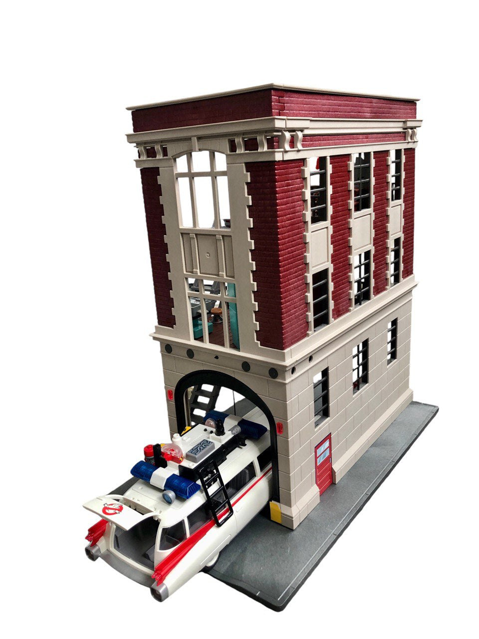 Ensemble Playmobil Ghostbusers 3 en 1 comprenant : Caserne de pompiers Ghostbusters, Voiture d'escouade Ghostbusters et Stay Puft Mashmallow Man